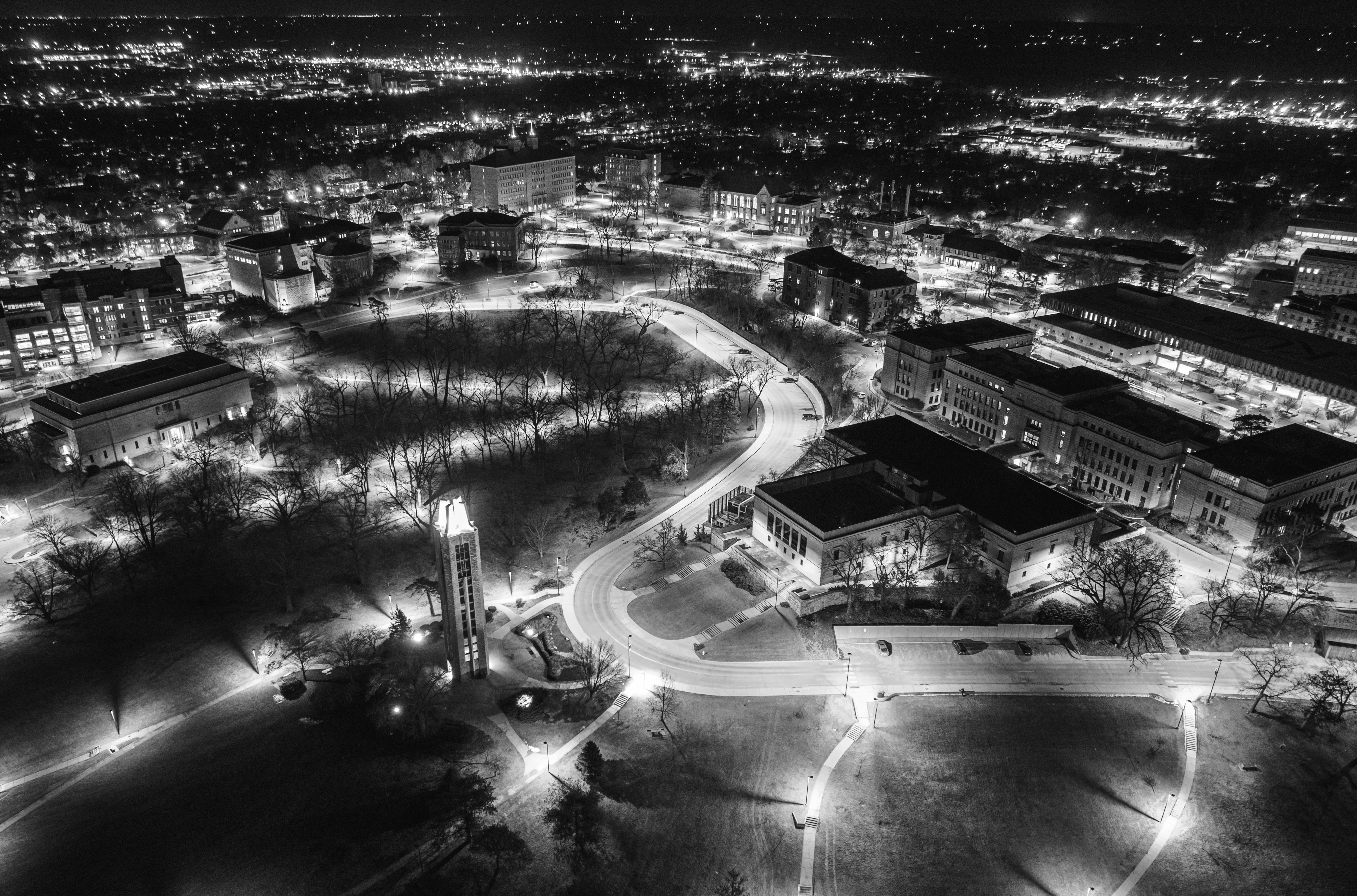 Ariel night photo of KU campus with street lights